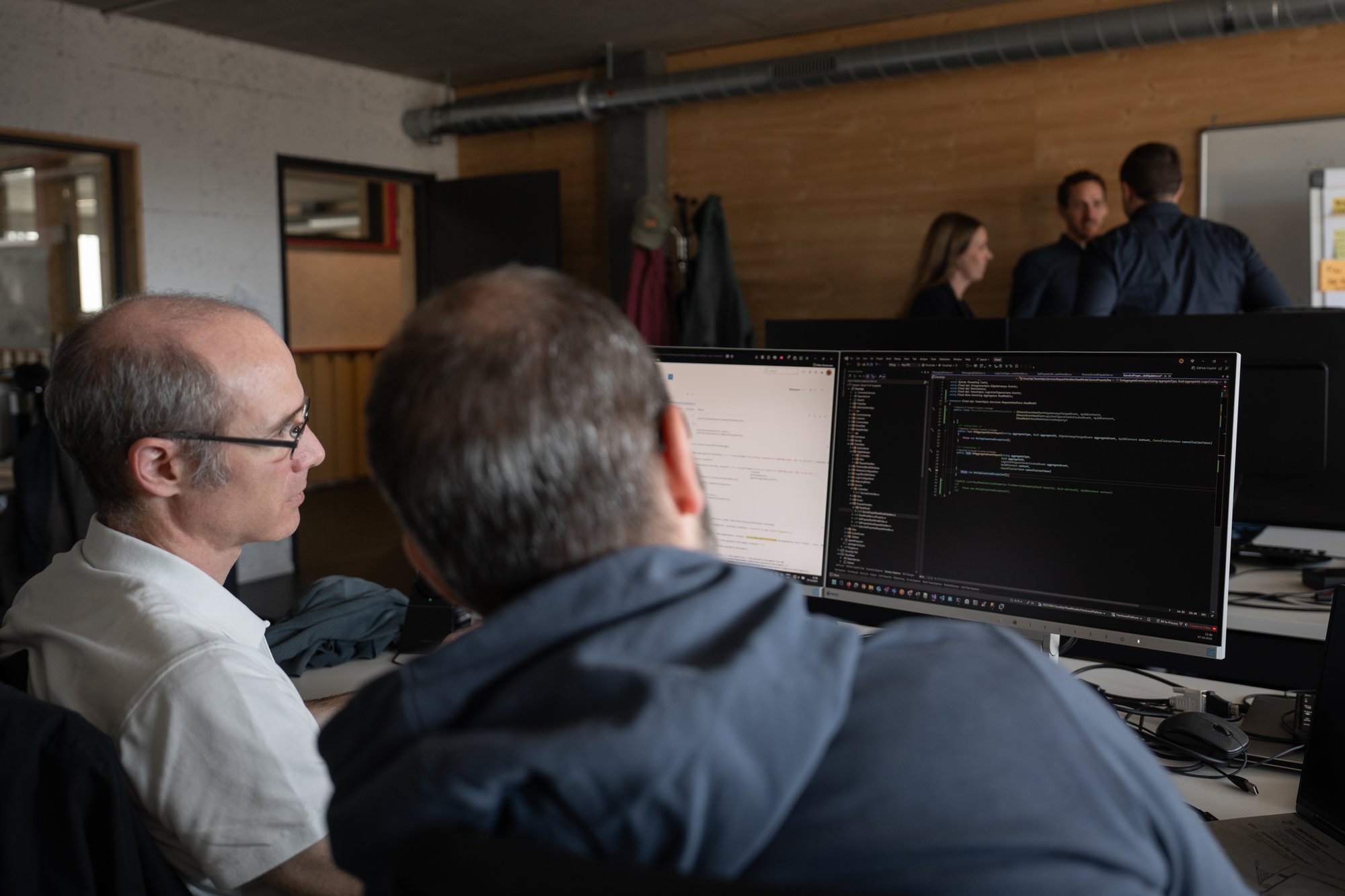 Entwickler VION, Team im Hintergrund Entwickler VION, Team im Hintergrund